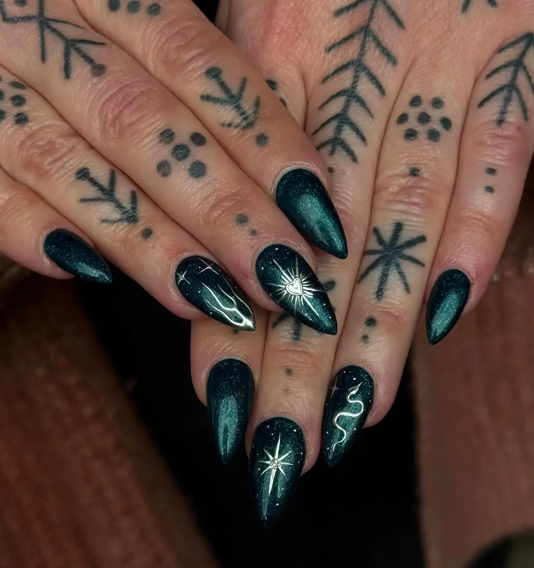 Enchanting dark green nails with star designs