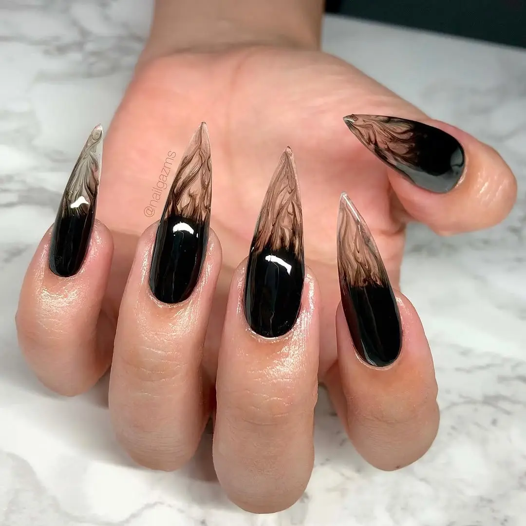 Stunning stiletto nails with witchy vibes