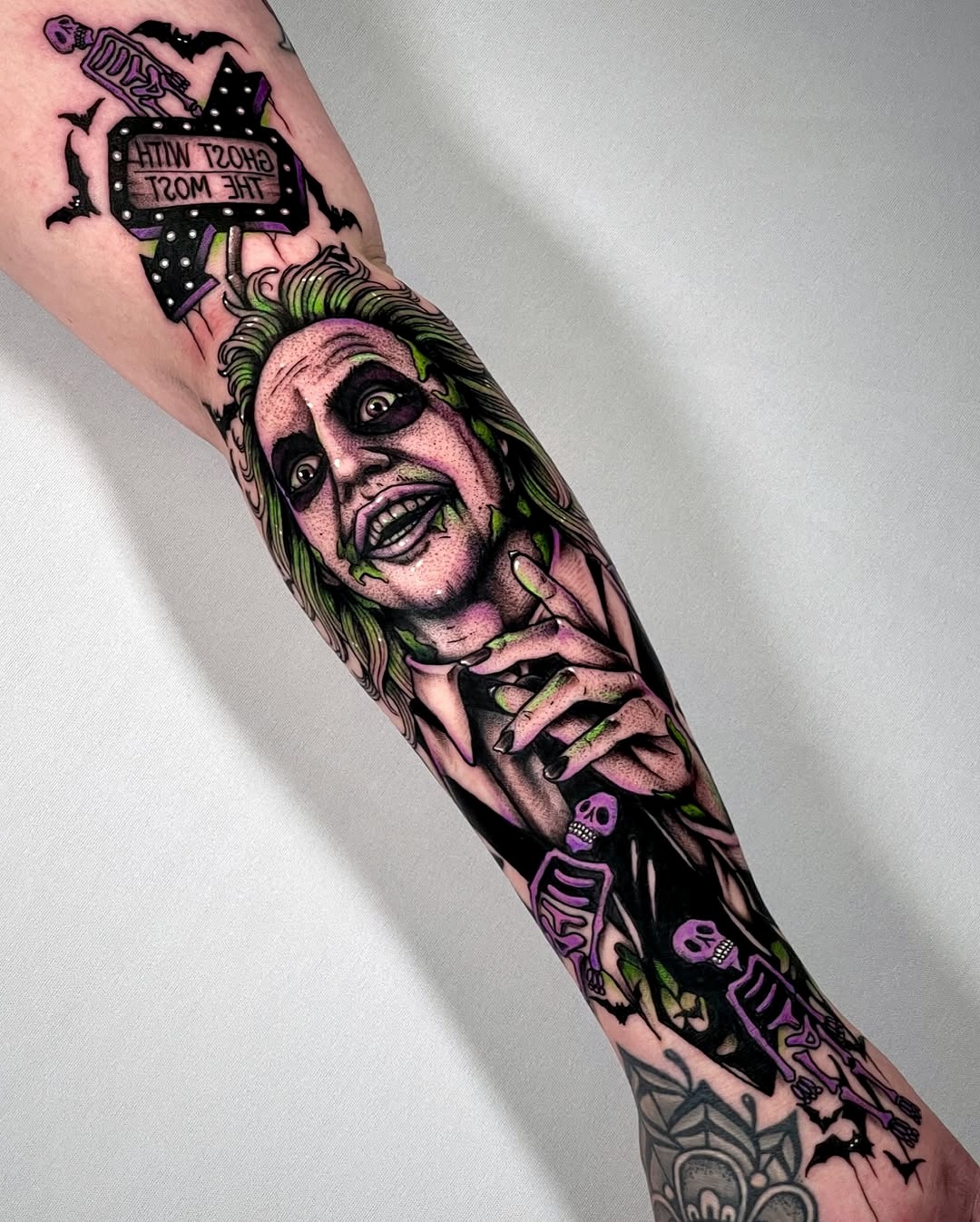 Vibrant Beetlejuice Forearm Tattoo Design
