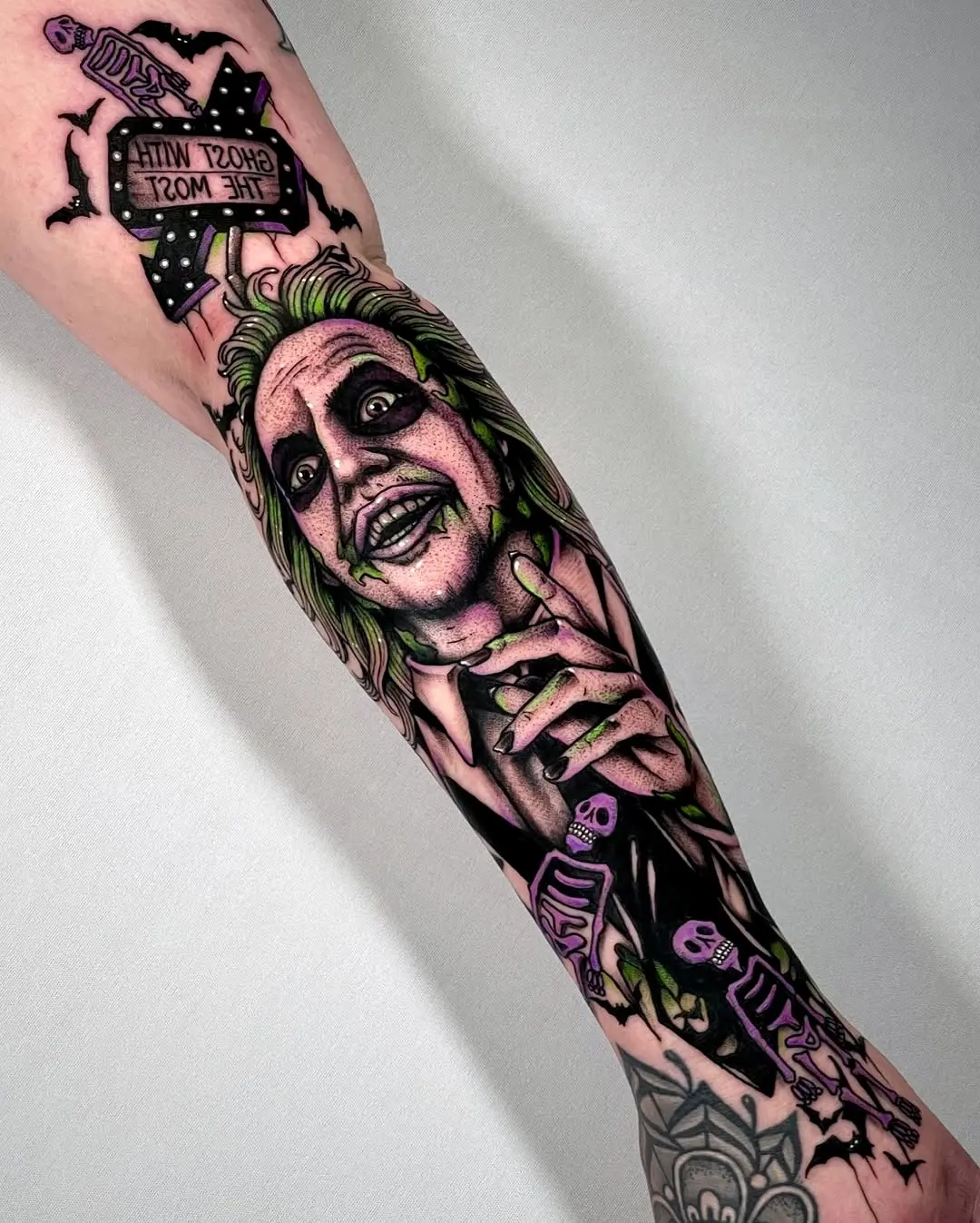 Vibrant Beetlejuice Forearm Tattoo Design