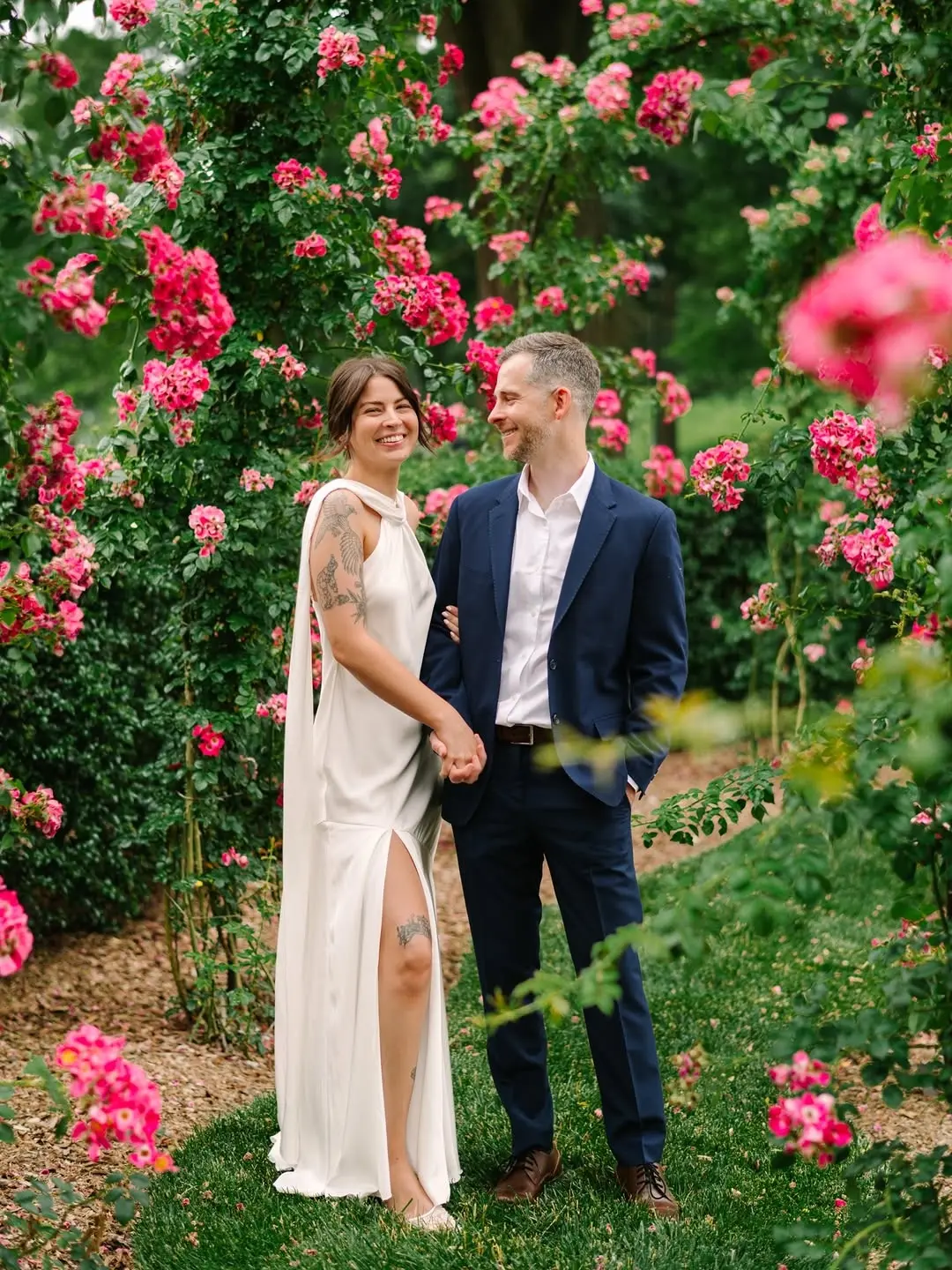 Elegant couple in a romantic rose garden