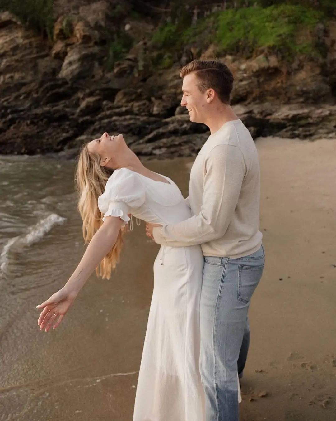 Elegant beach outfits for joyful engagement photos