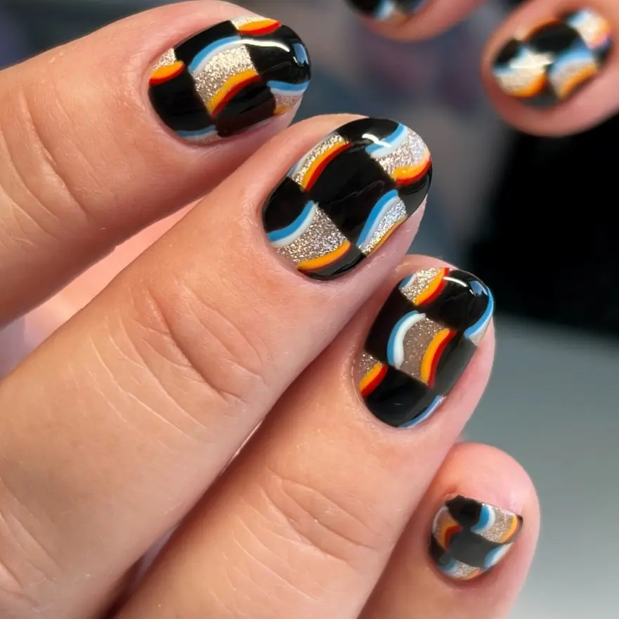 Bold geometric patterns on stylish nails