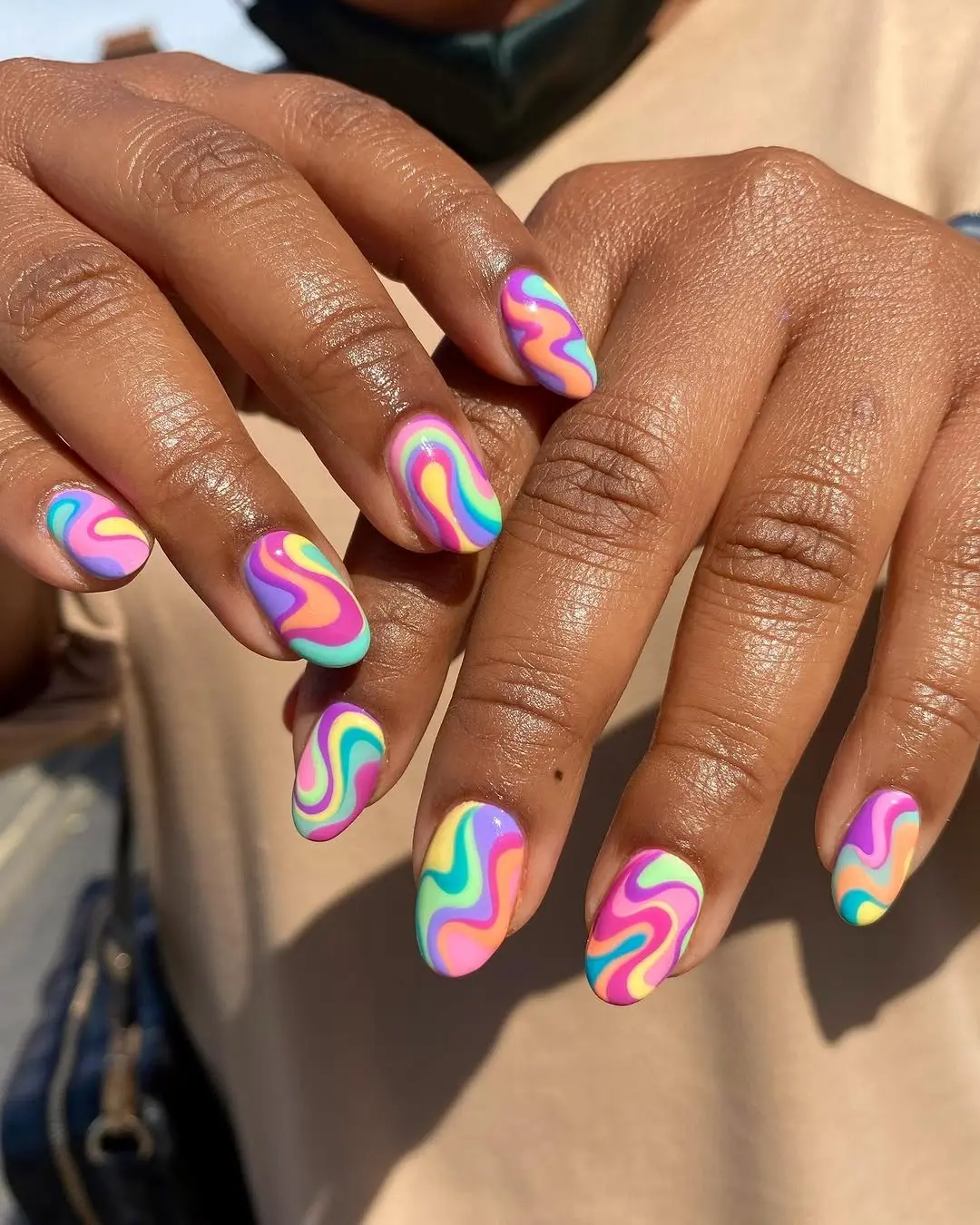 Vibrant Swirling Pattern on Trendy Nails