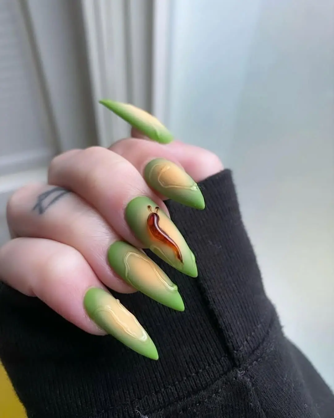 Chic green nails with unique artistry