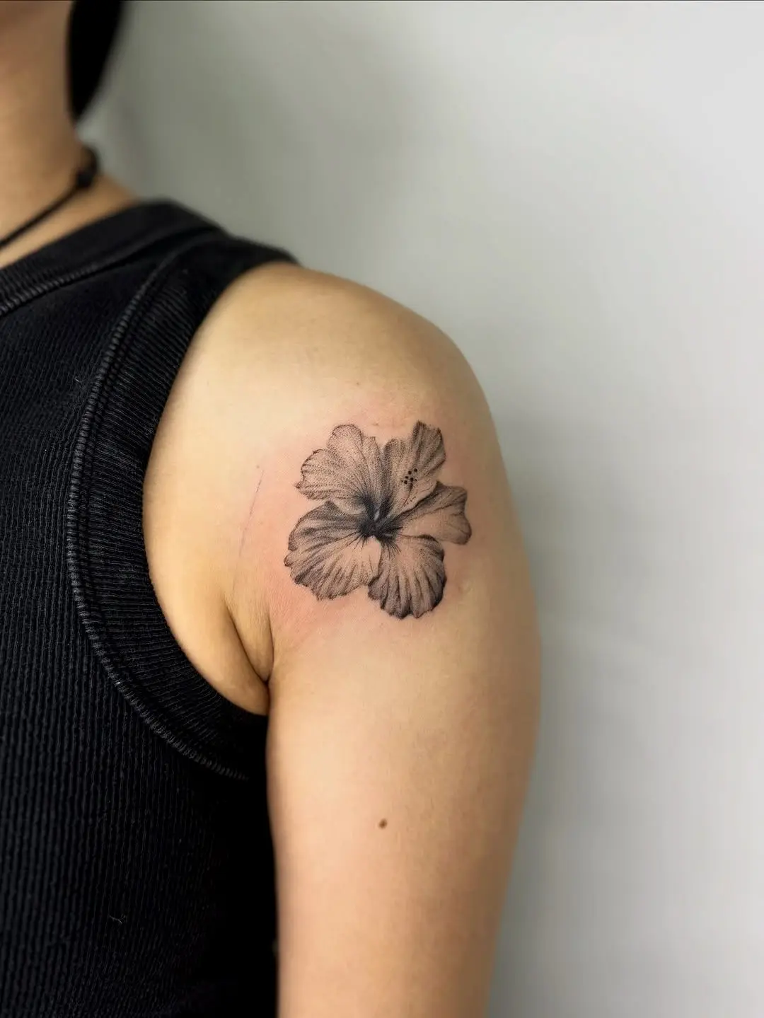Elegant black and gray hibiscus tattoo