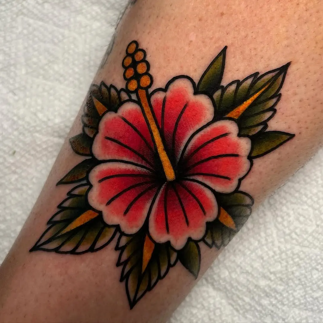 Vibrant hibiscus tattoo in bold colors