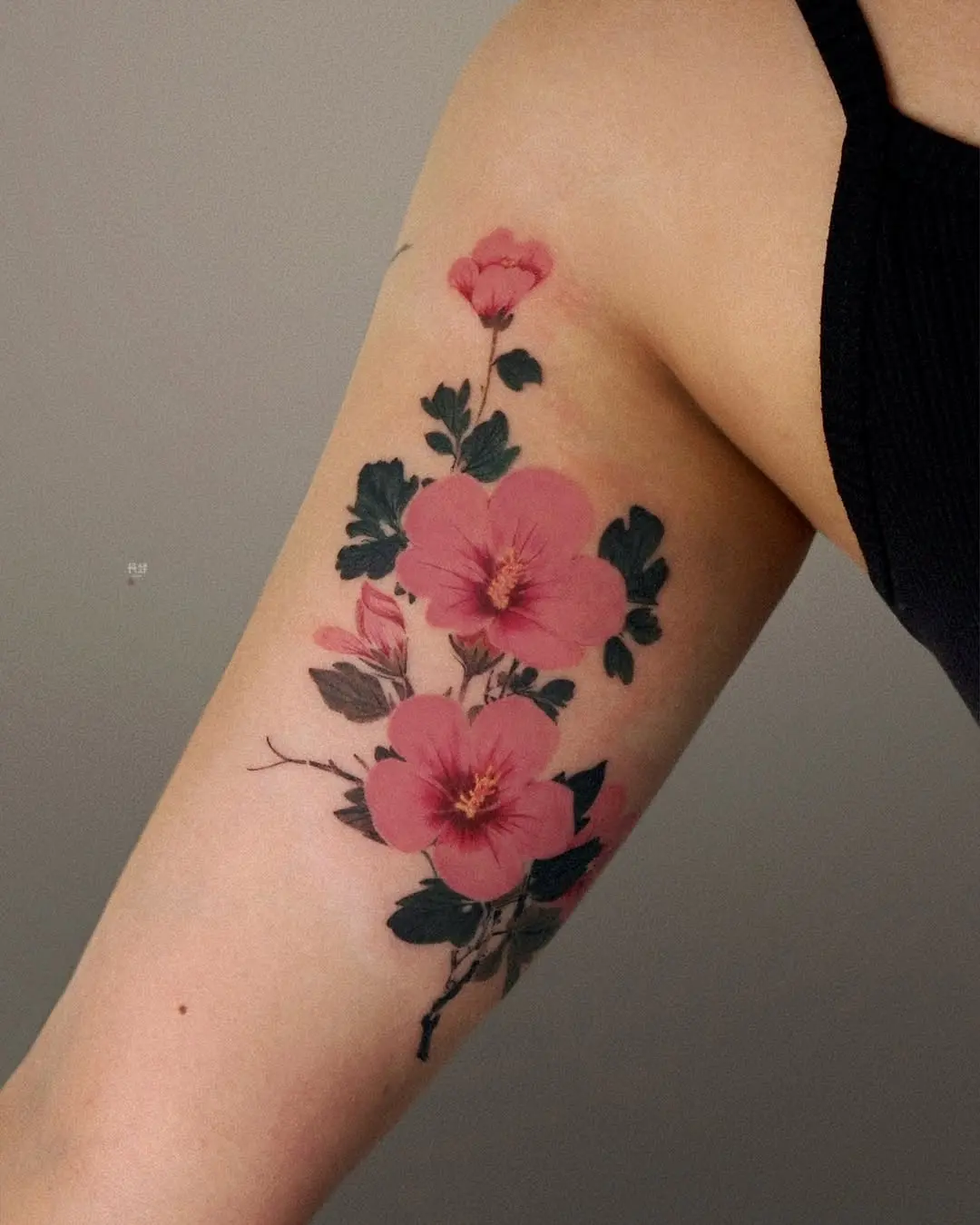 Feminine and vibrant hibiscus tattoo design