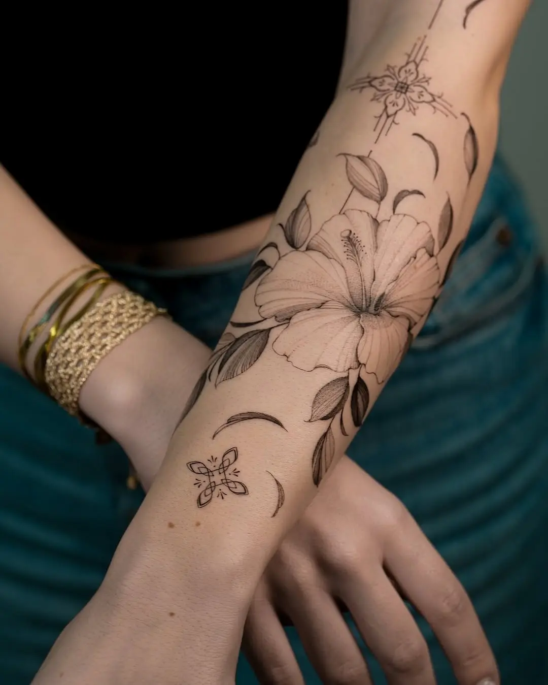 Elegant hibiscus tattoo design on the arm