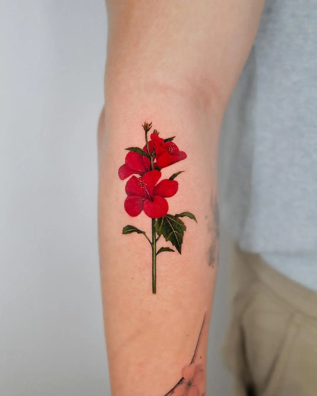 Bold Hibiscus Tattoo with Vivid Red Blooms