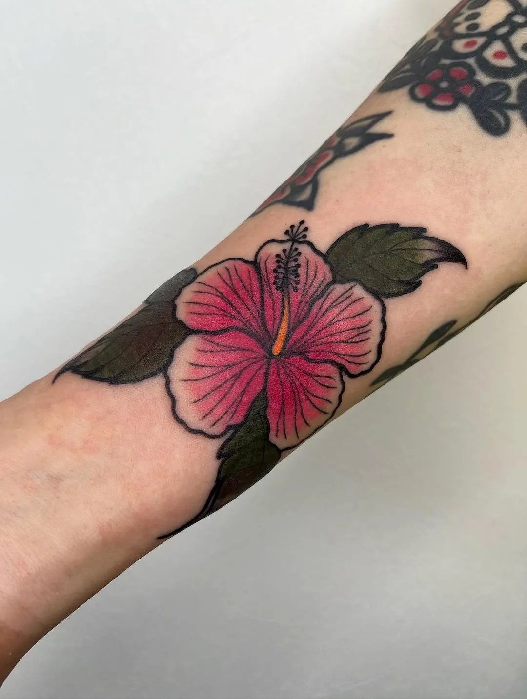 Vibrant Hibiscus Tattoo on the Arm