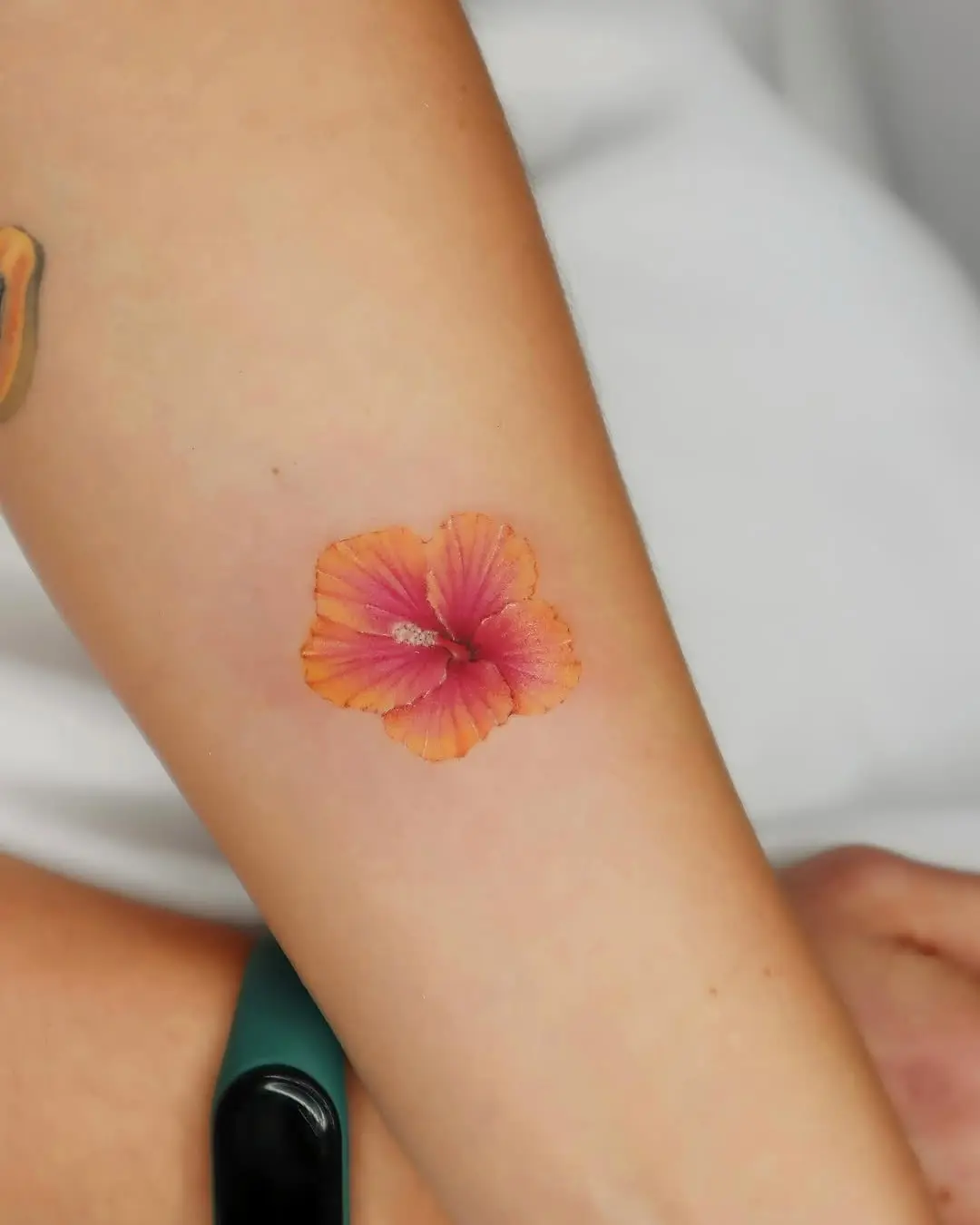 Beautiful hibiscus flower tattoo on the arm
