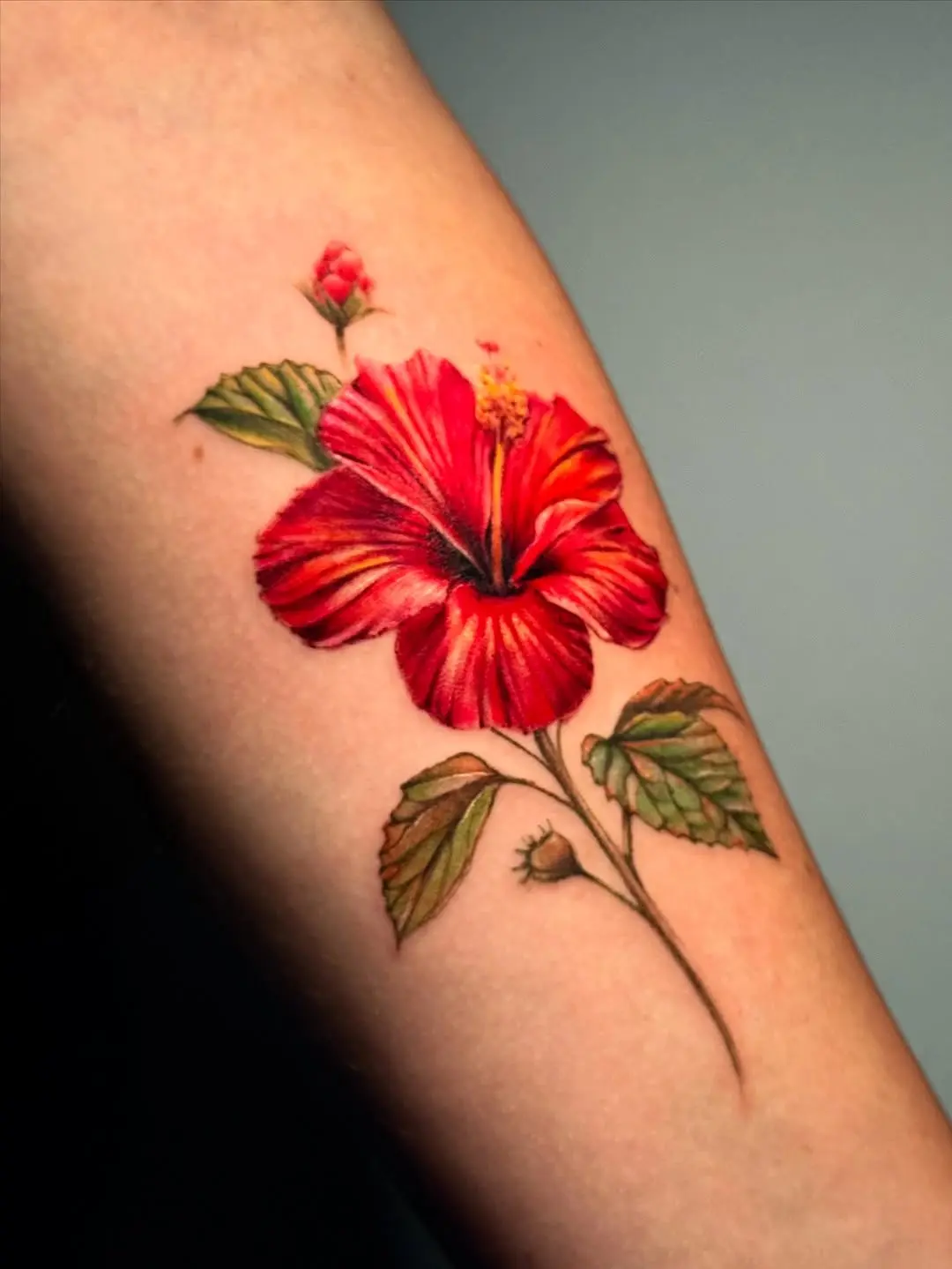 Vibrant hibiscus tattoo delivering tropical vibes