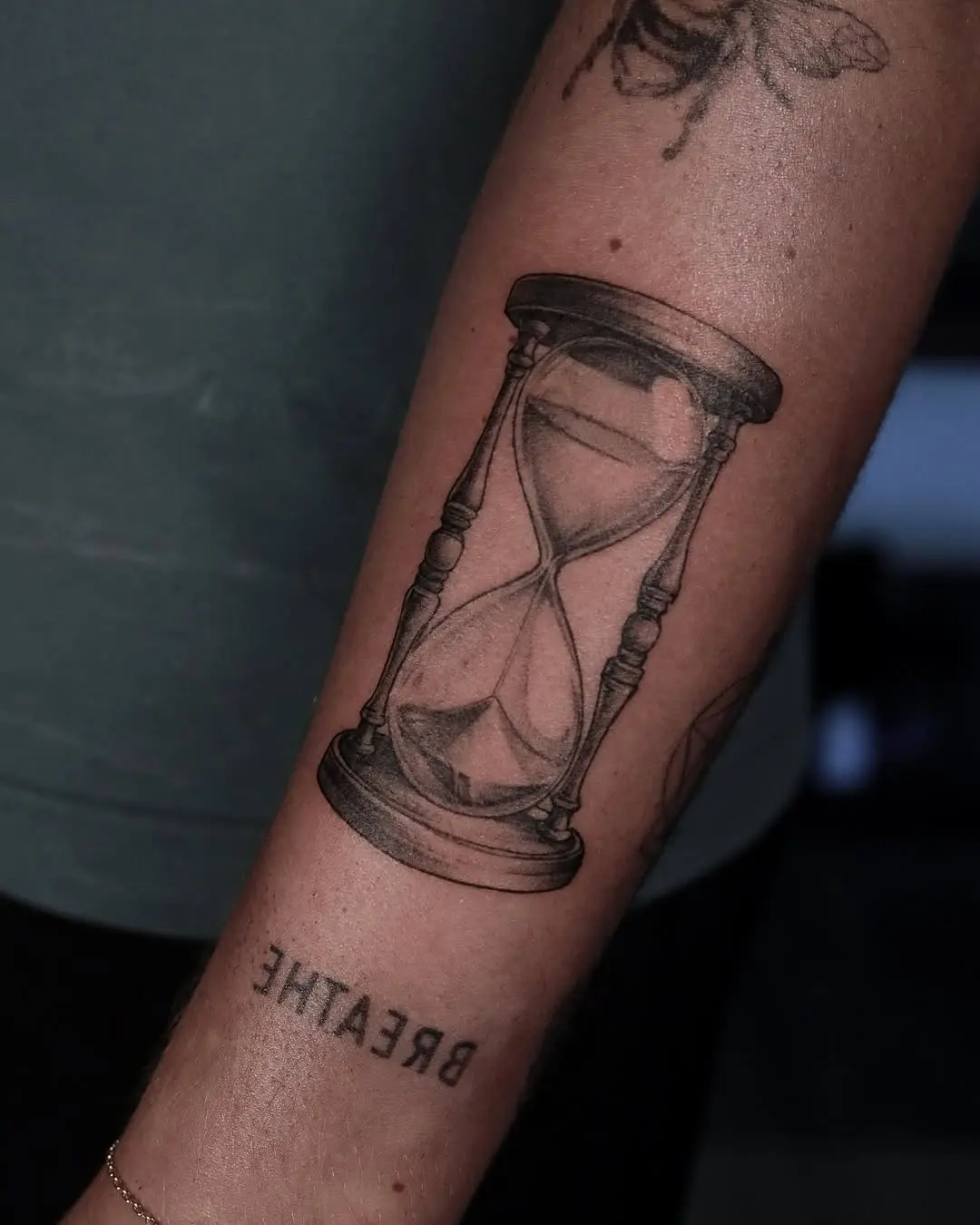 Elegant hourglass tattoo representing time's beauty