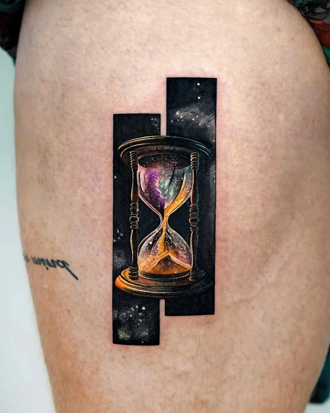 Stunning galaxy hourglass tattoo on skin