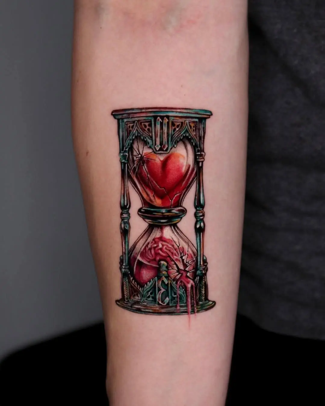 Creative hourglass tattoo with a heart design
