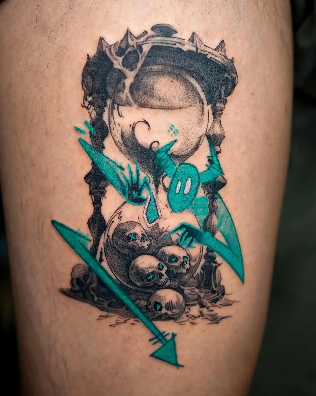Creative hourglass tattoo with skulls and colors