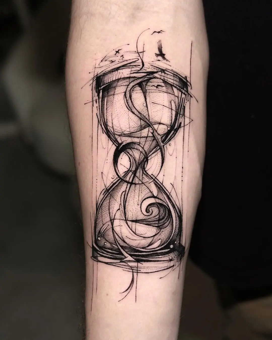 Artistic hourglass tattoo with intricate details
