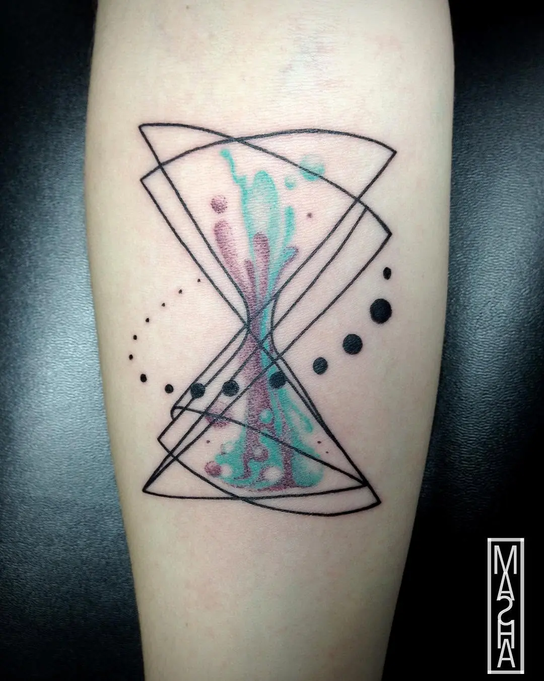 Stylish hourglass tattoo with abstract flair