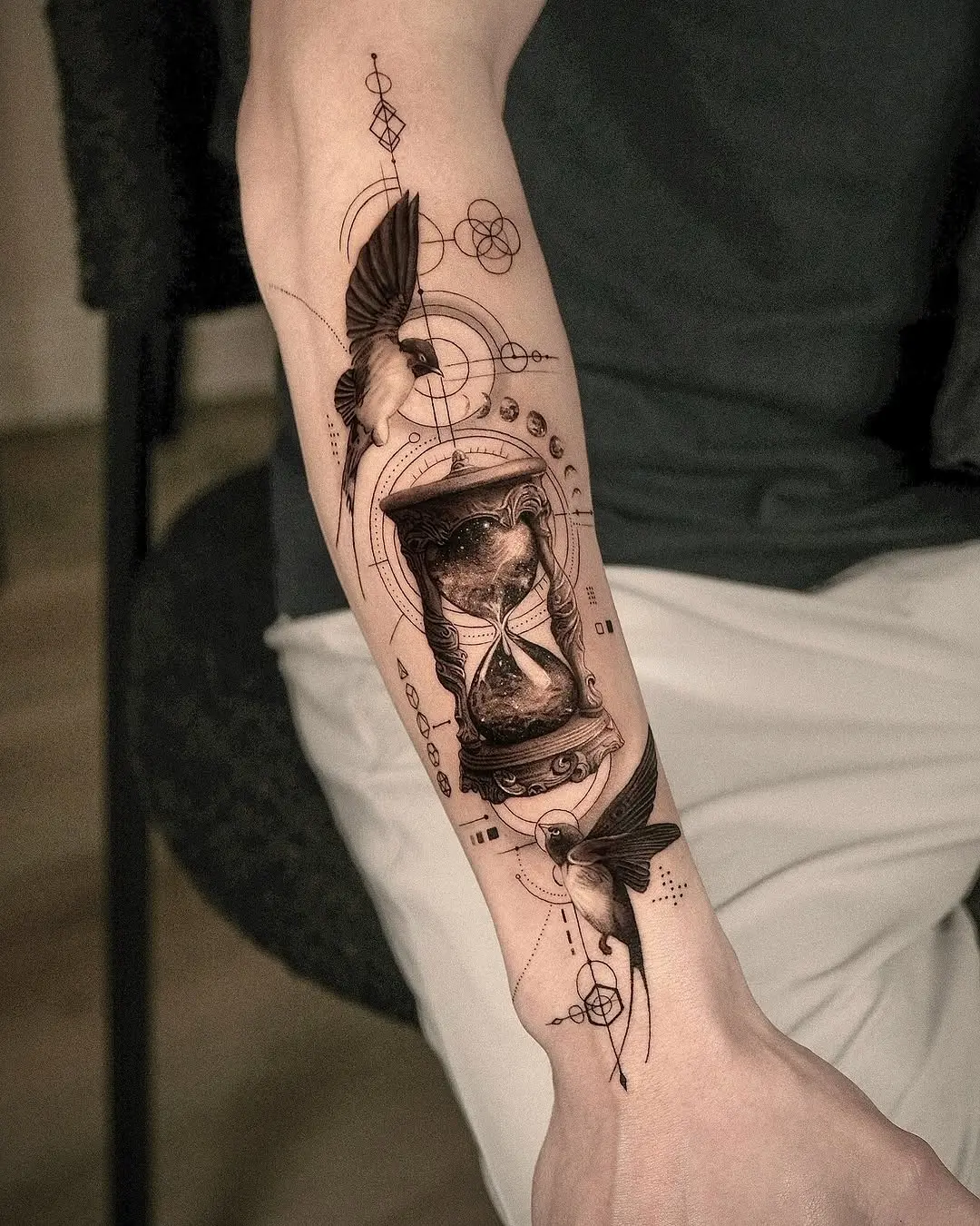 Intricate hourglass tattoo with dynamic elements