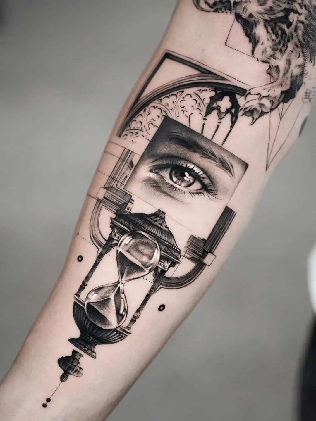 Intricate eye and hourglass tattoo design