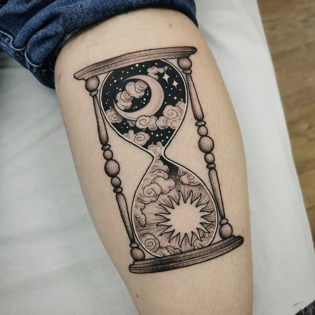 Intricate hourglass tattoo with cosmic elements