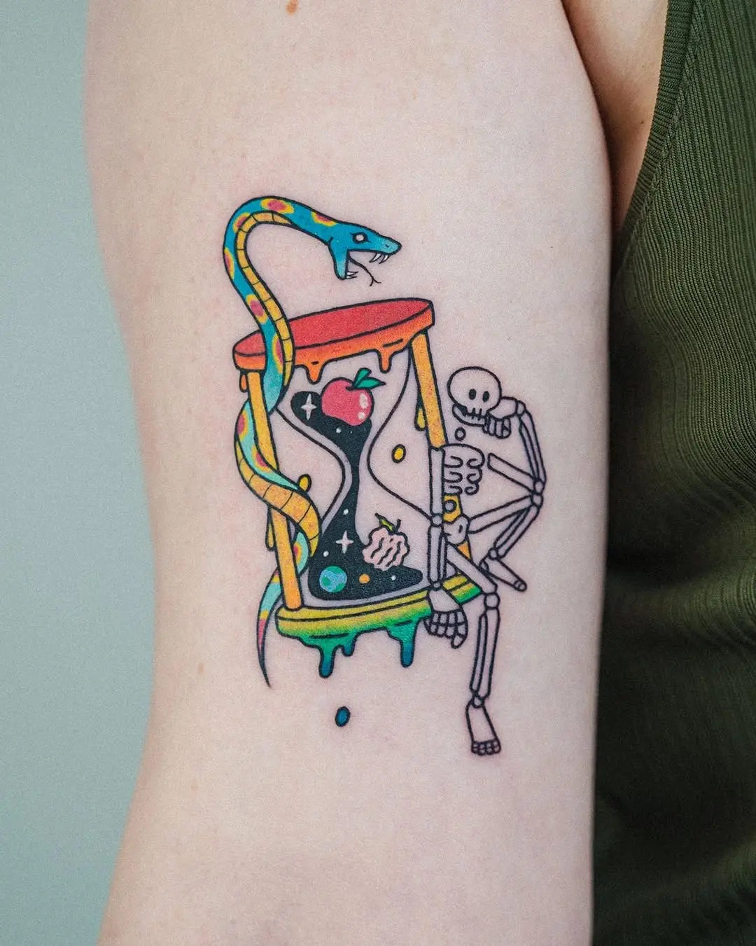 Colorful hourglass tattoo with skeleton and snake