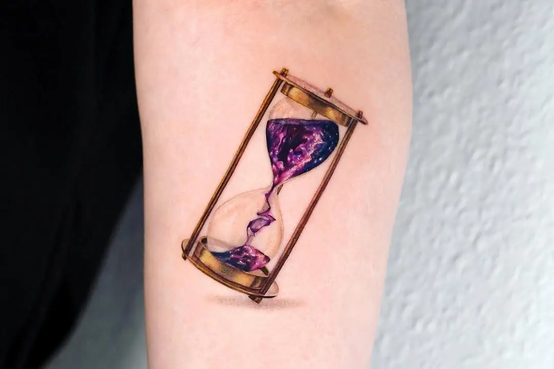Vibrant hourglass tattoo with galaxy effects