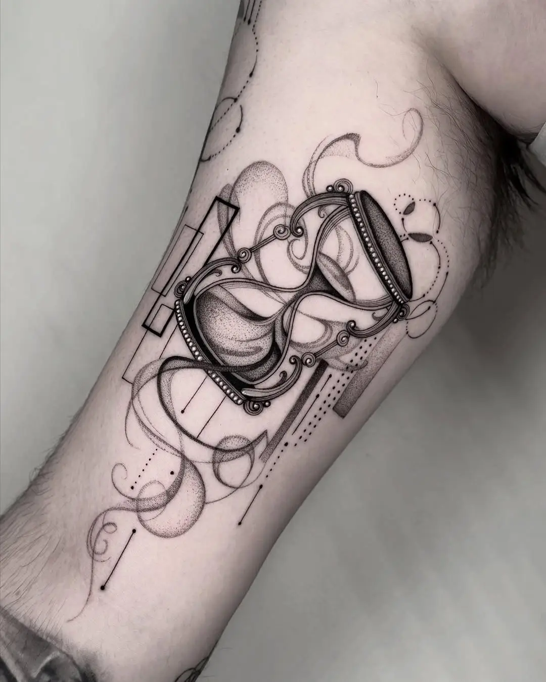 Intricate Hourglass Tattoo with Abstract Patterns