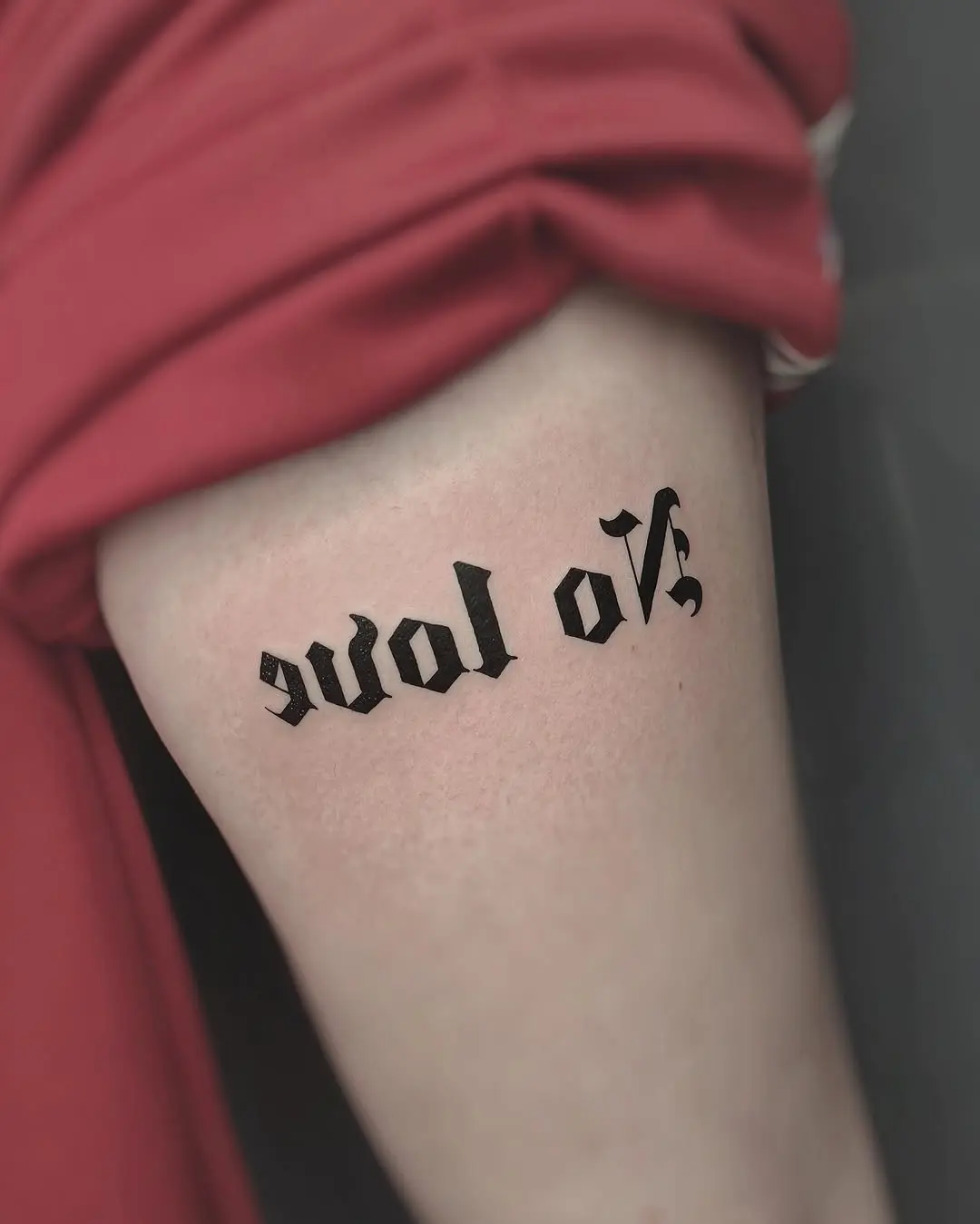 Striking no love tattoo in bold lettering