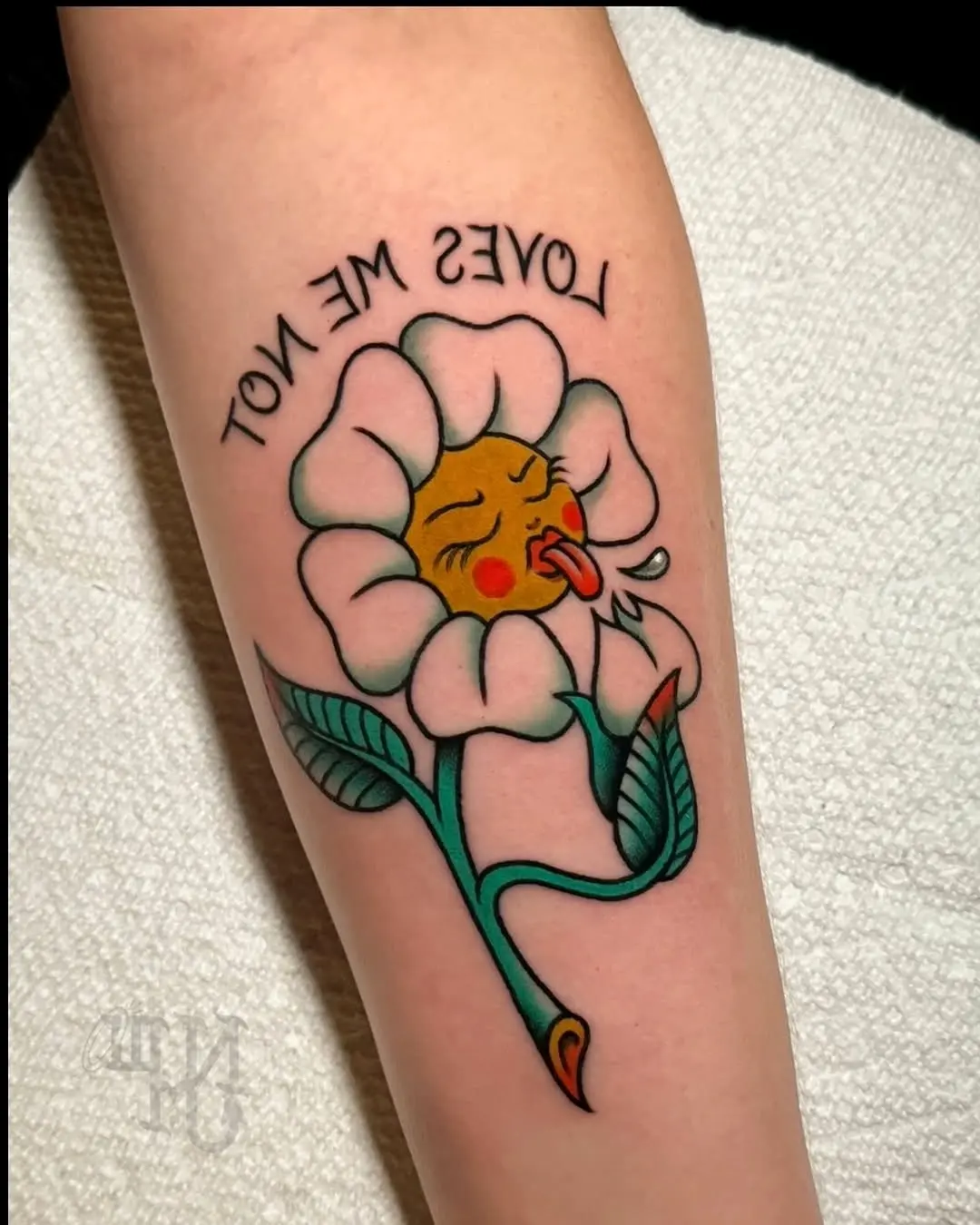 Whimsical flower tattoo expressing playful vibes