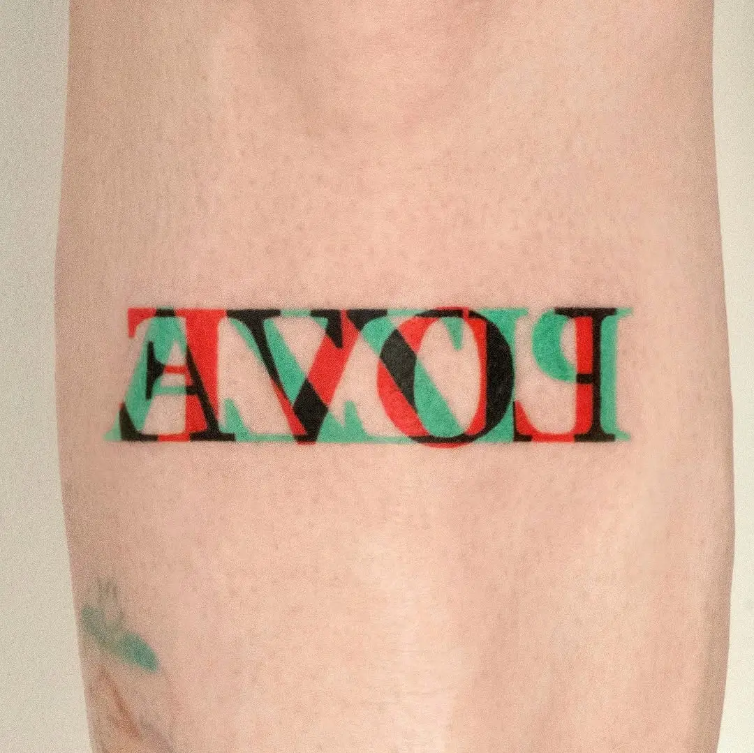 Vibrant tattoo exhibiting bold text design