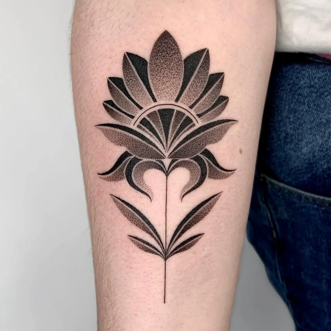 Elegant black flower tattoo with intricate details