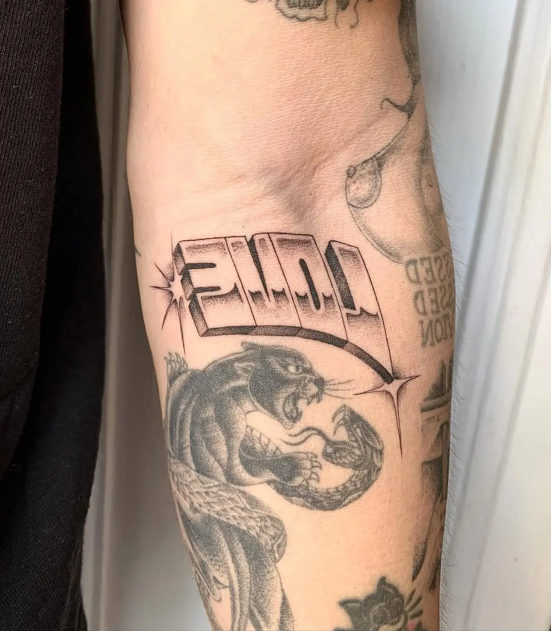 Powerful Puma Tattoo with Unique Typography