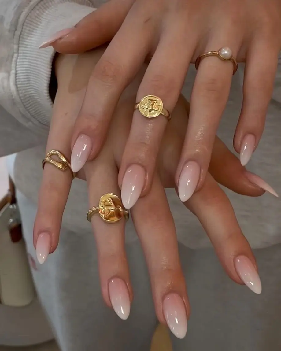 Chic Ombre Nails with Elegant Gold Accessories