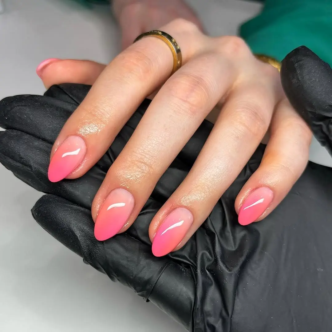 Vibrant pink ombre nails for a chic look