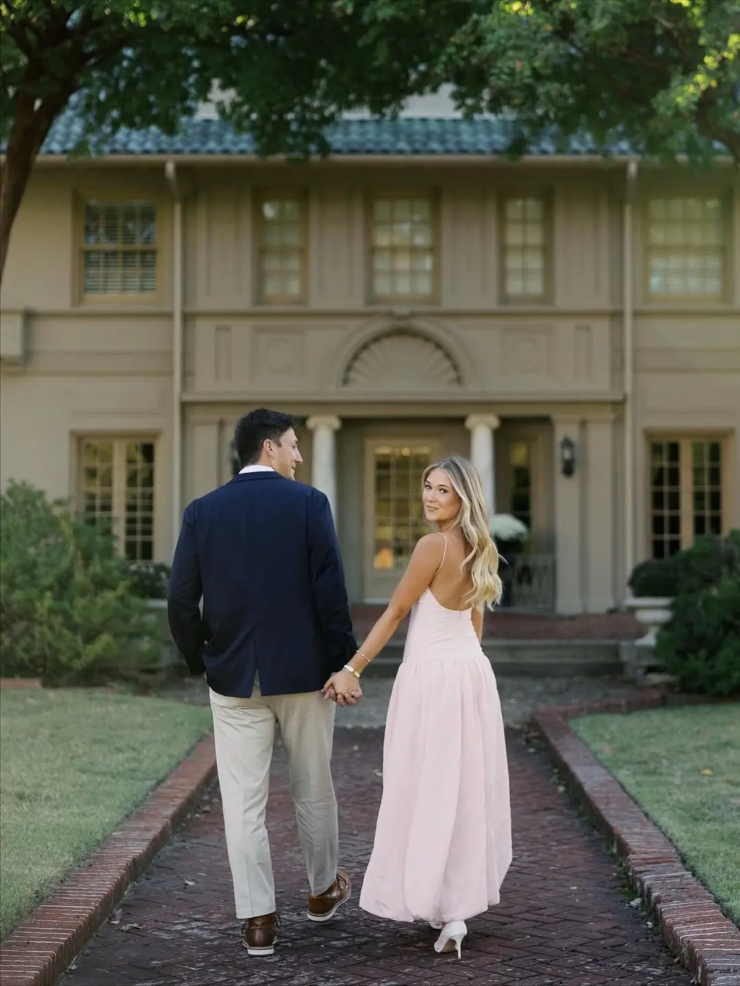 Elegant couple in soft pastel engagement attire