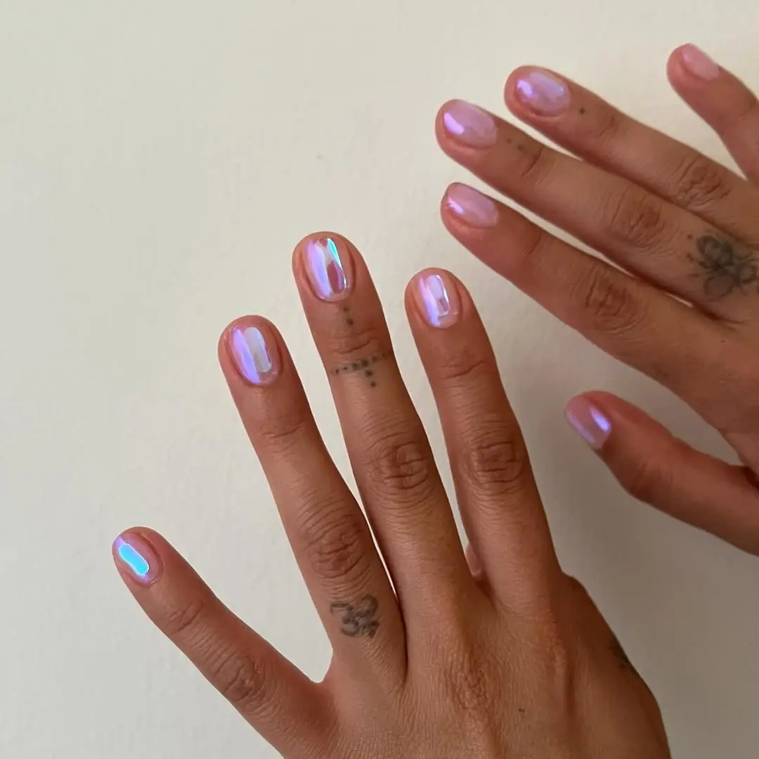 Chic and trendy iridescent pink nails.
