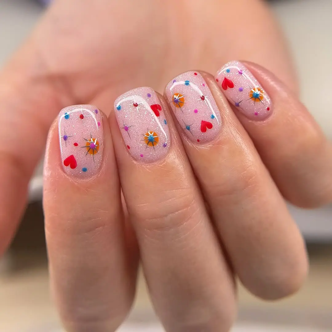 Charming spring nails with playful glitter accents