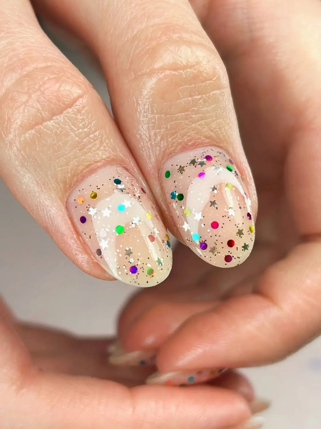 Summer-inspired nude glitter nail design