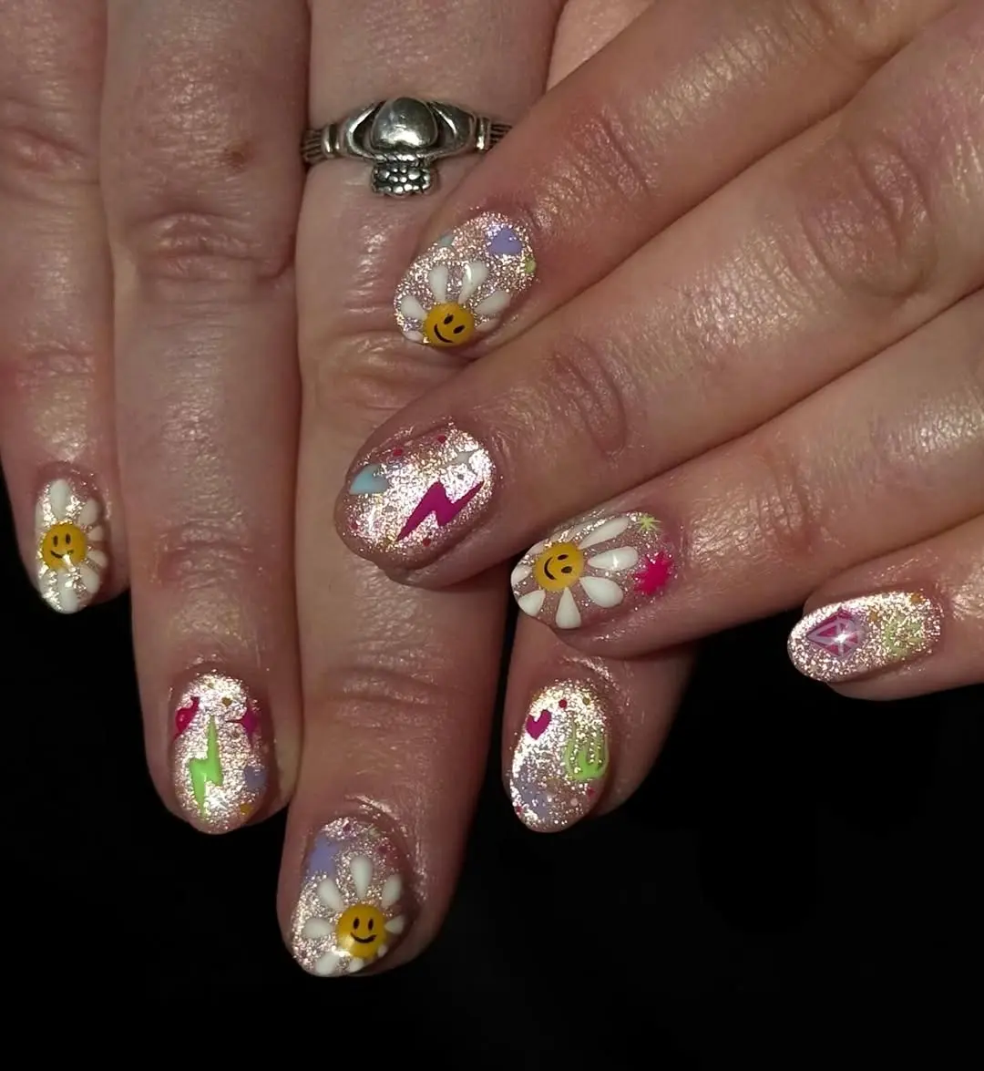 Colorful spring glitter nails with playful designs