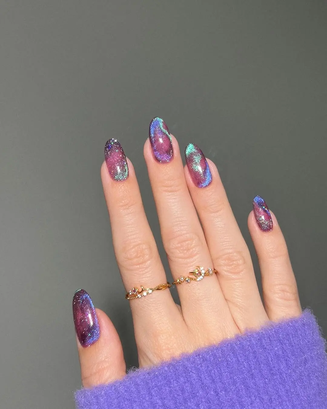 Vivid galaxy-inspired spring glitter nails