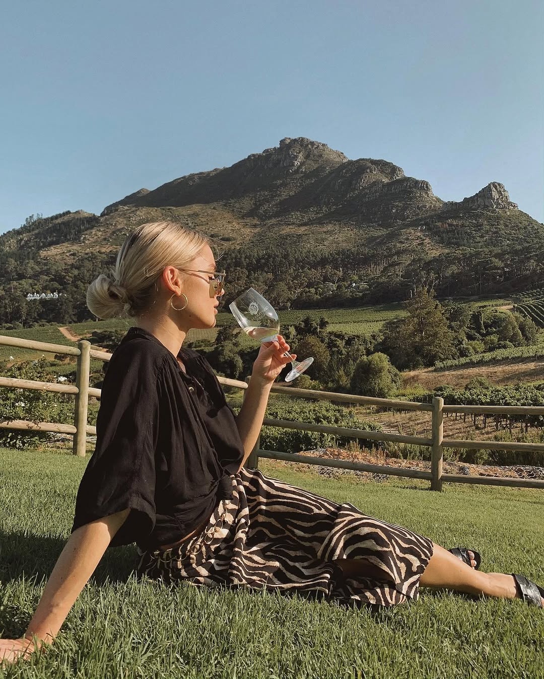 Chic winery outfit with stunning mountain backdrop