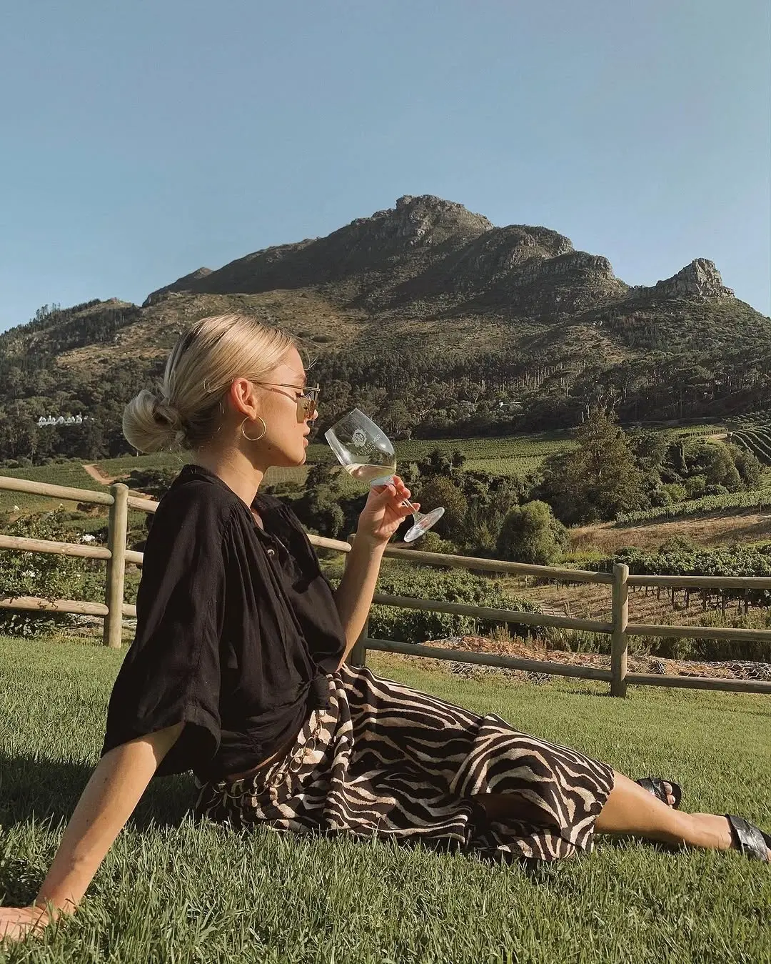 Chic winery outfit with stunning mountain backdrop