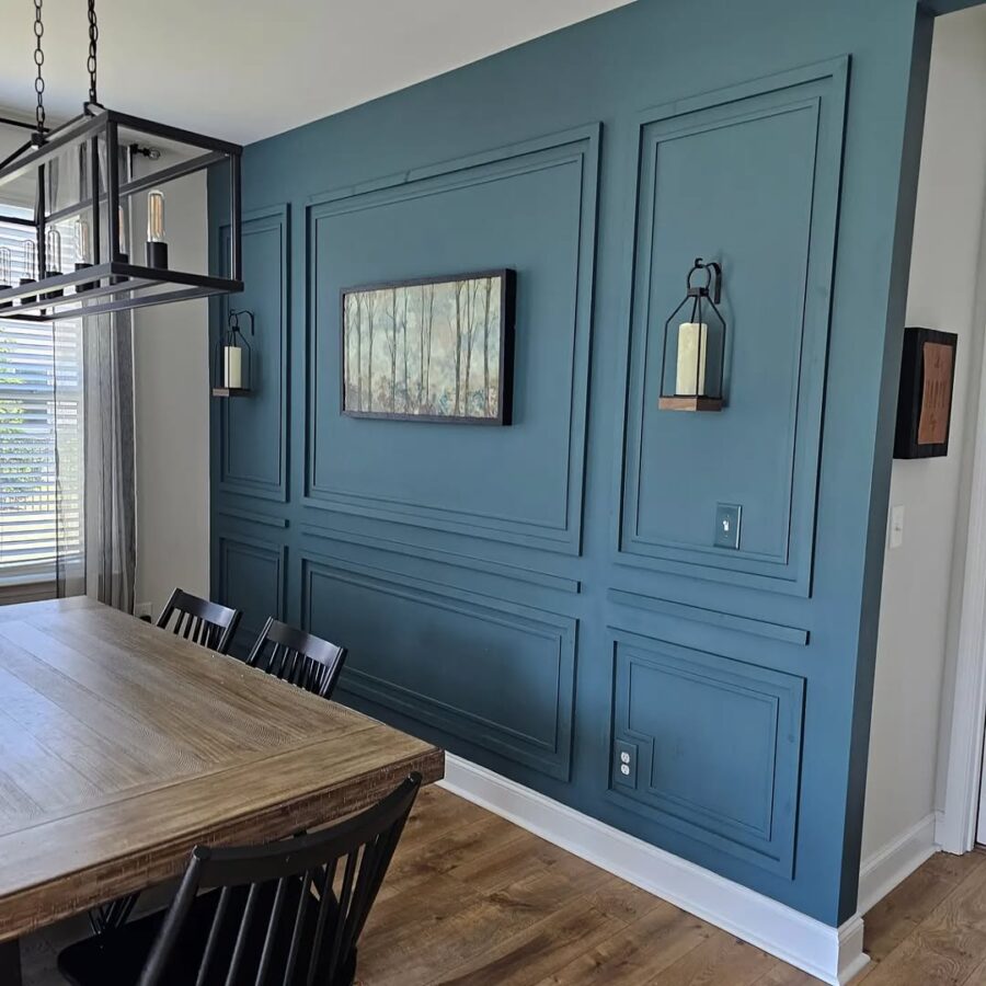 Elegant blue accent wall enhances dining space