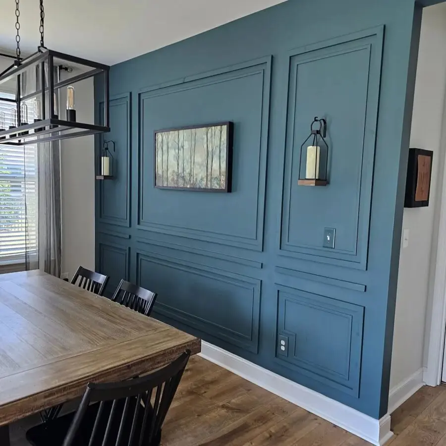 Elegant blue accent wall enhances dining space