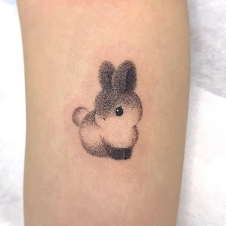 Charming minimalistic rabbit tattoo design