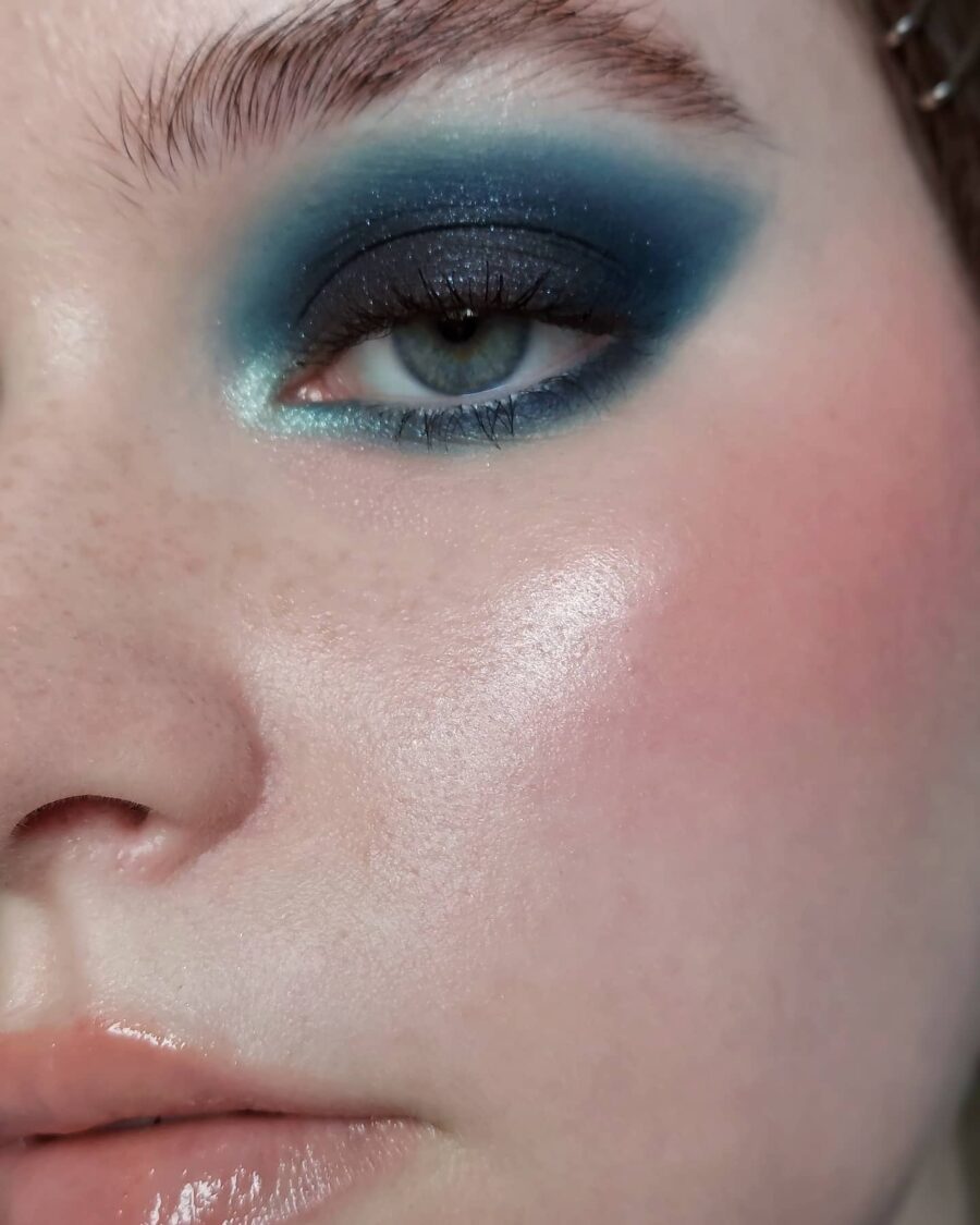 Striking baby blue and dark eye makeup look