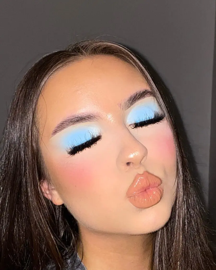Radiant baby blue makeup with glam accents
