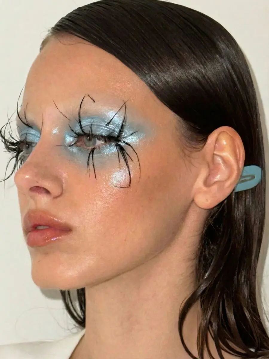 Striking baby blue makeup with artistic lashes